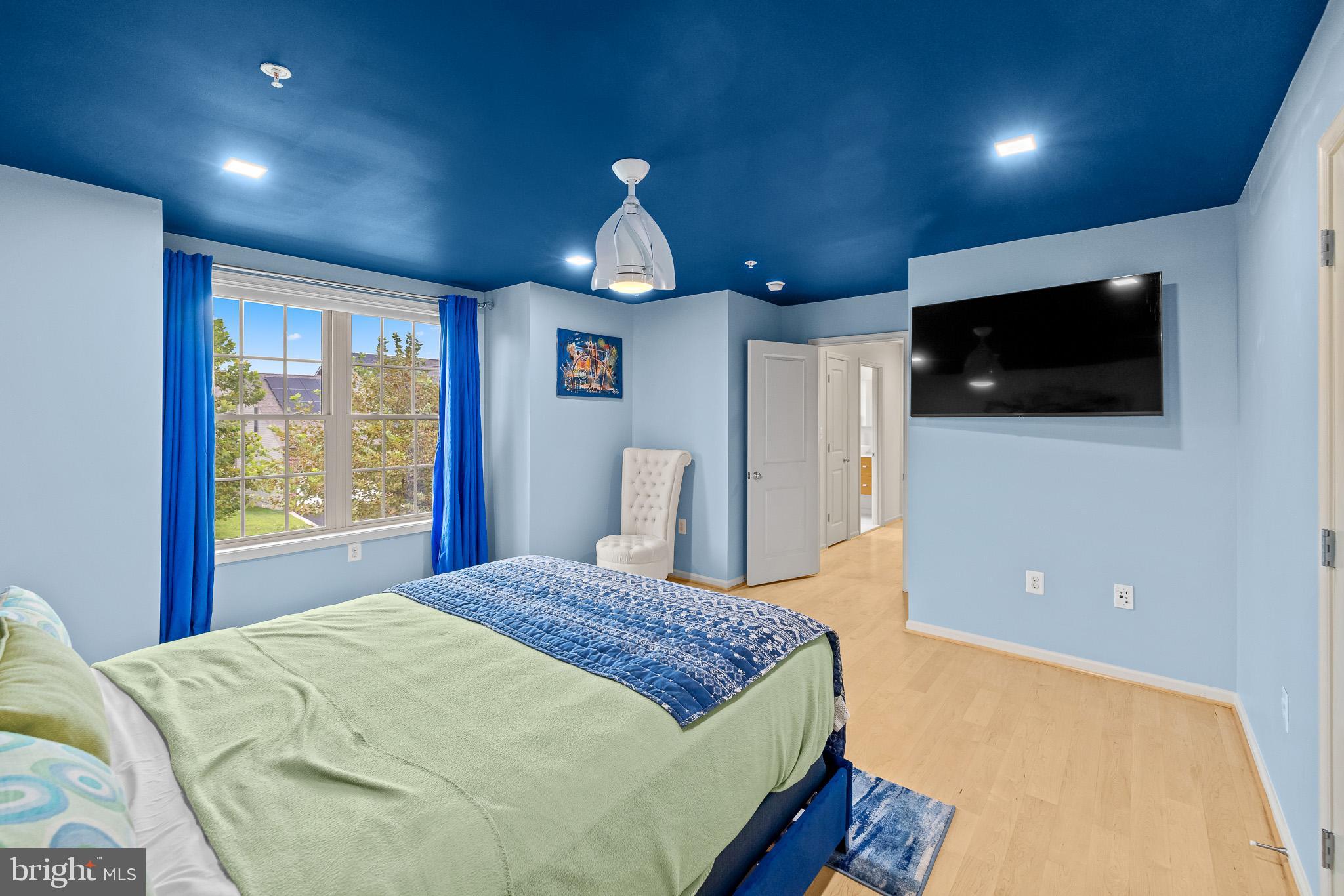 1116 Autumn Brook Avenue Silver Spring, MD 20906 - Photo 48 of 67 a spacious bedroom with a large bed and a flat screen tv