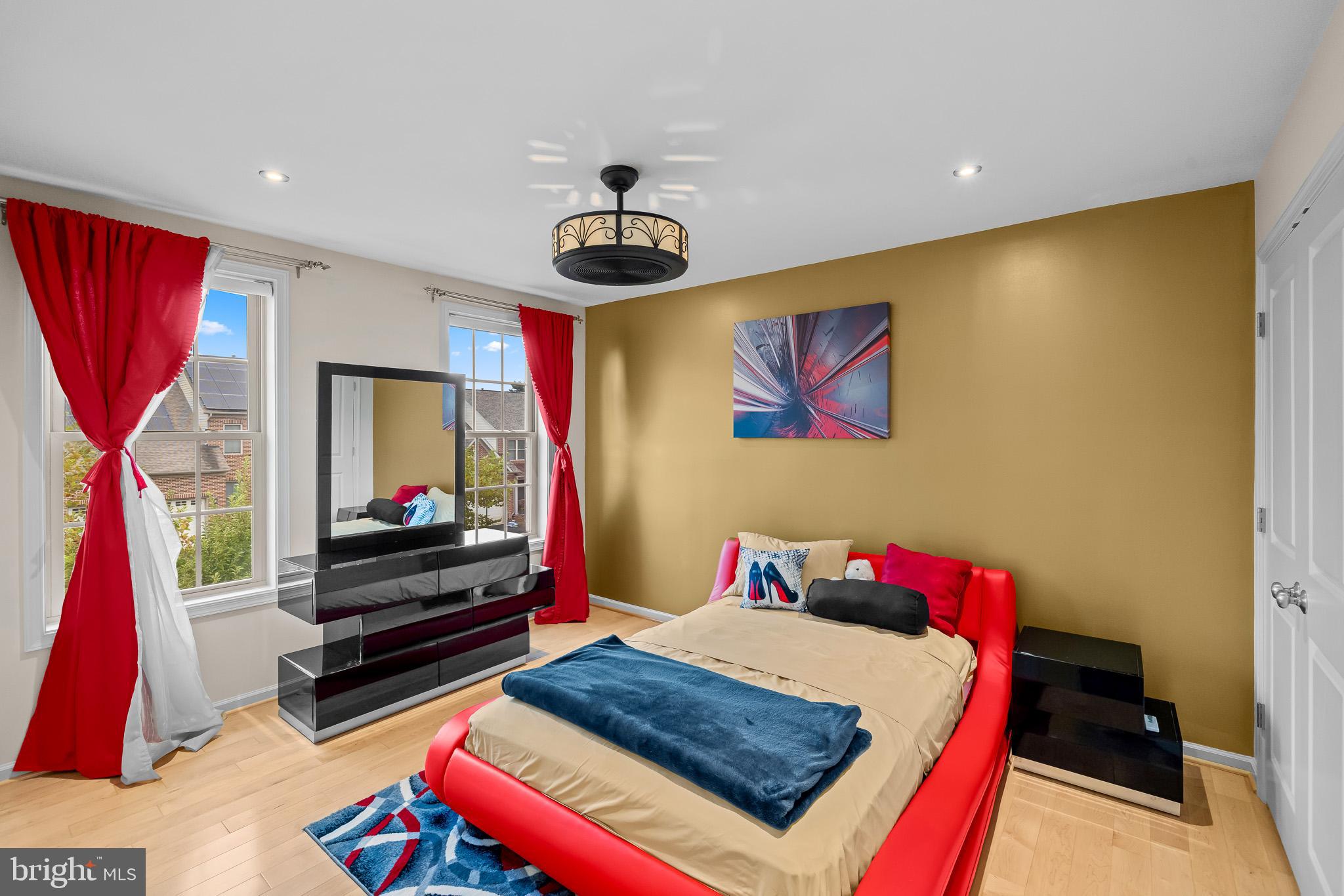 1116 Autumn Brook Avenue Silver Spring, MD 20906 - Photo 49 of 67 a bedroom with a bed and a flat screen tv