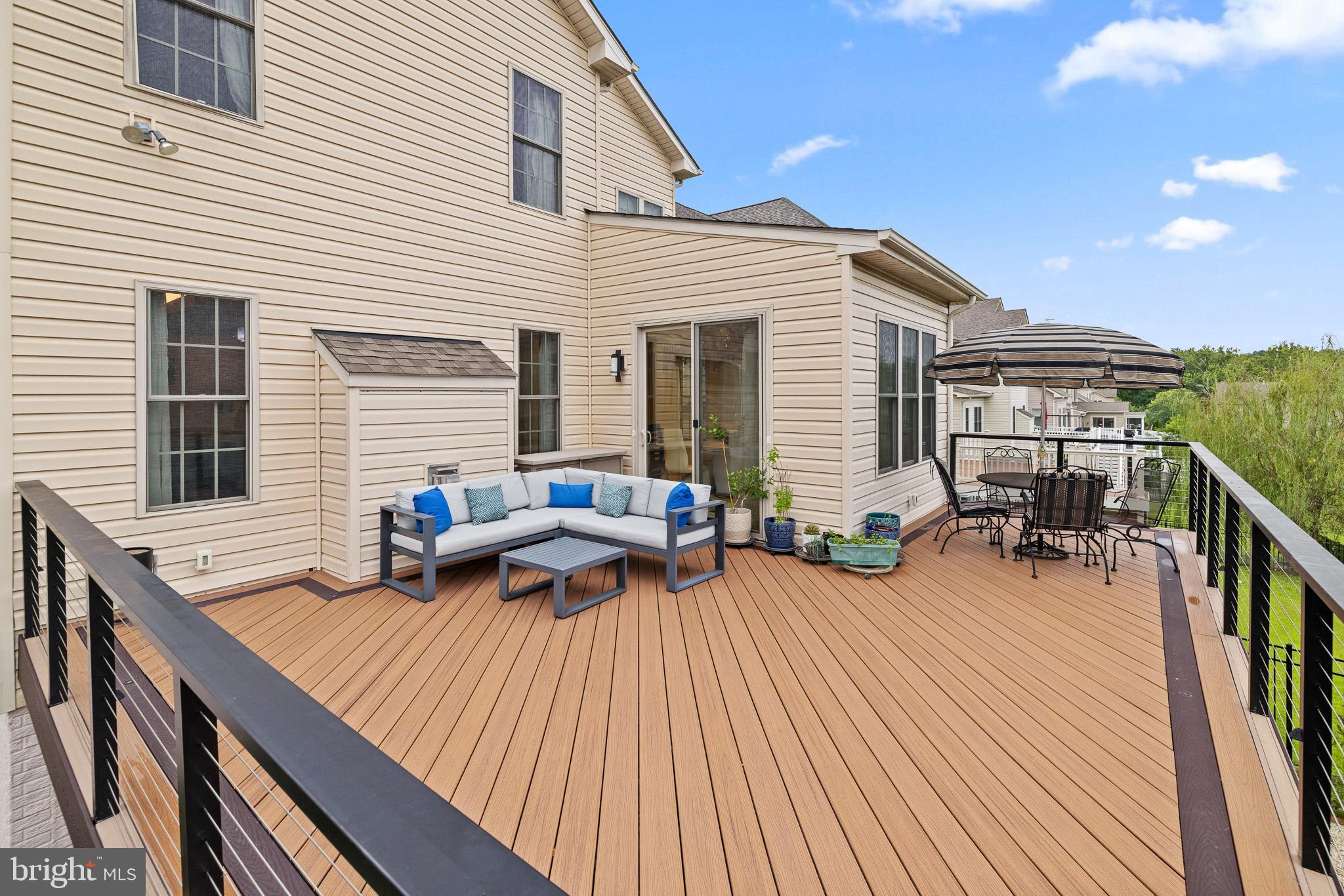 1116 Autumn Brook Avenue Silver Spring, MD 20906 - Photo 59 of 67 a view of a deck with chairs and wooden floor