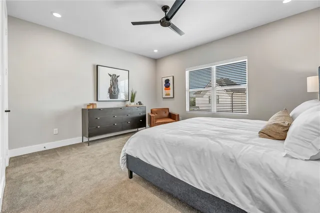 a bathroom with a granite countertop sink a toilet and bathtub