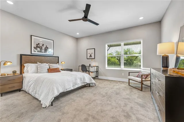 a bedroom with a bed and a couch