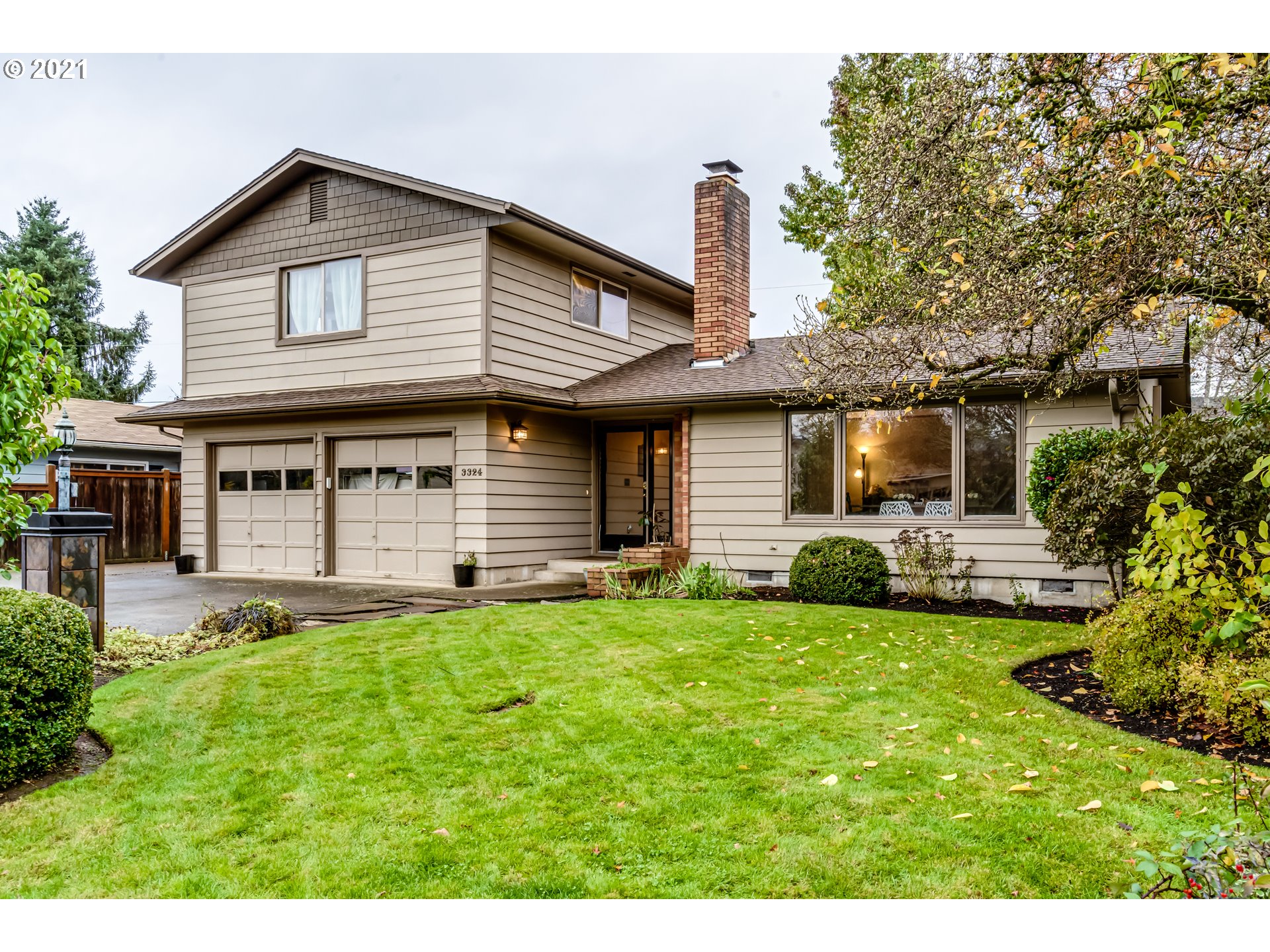 3324 Montebello Avenue Springfield, OR 97477 - Photo 1 of 32 a front view of a house with a yard and garage