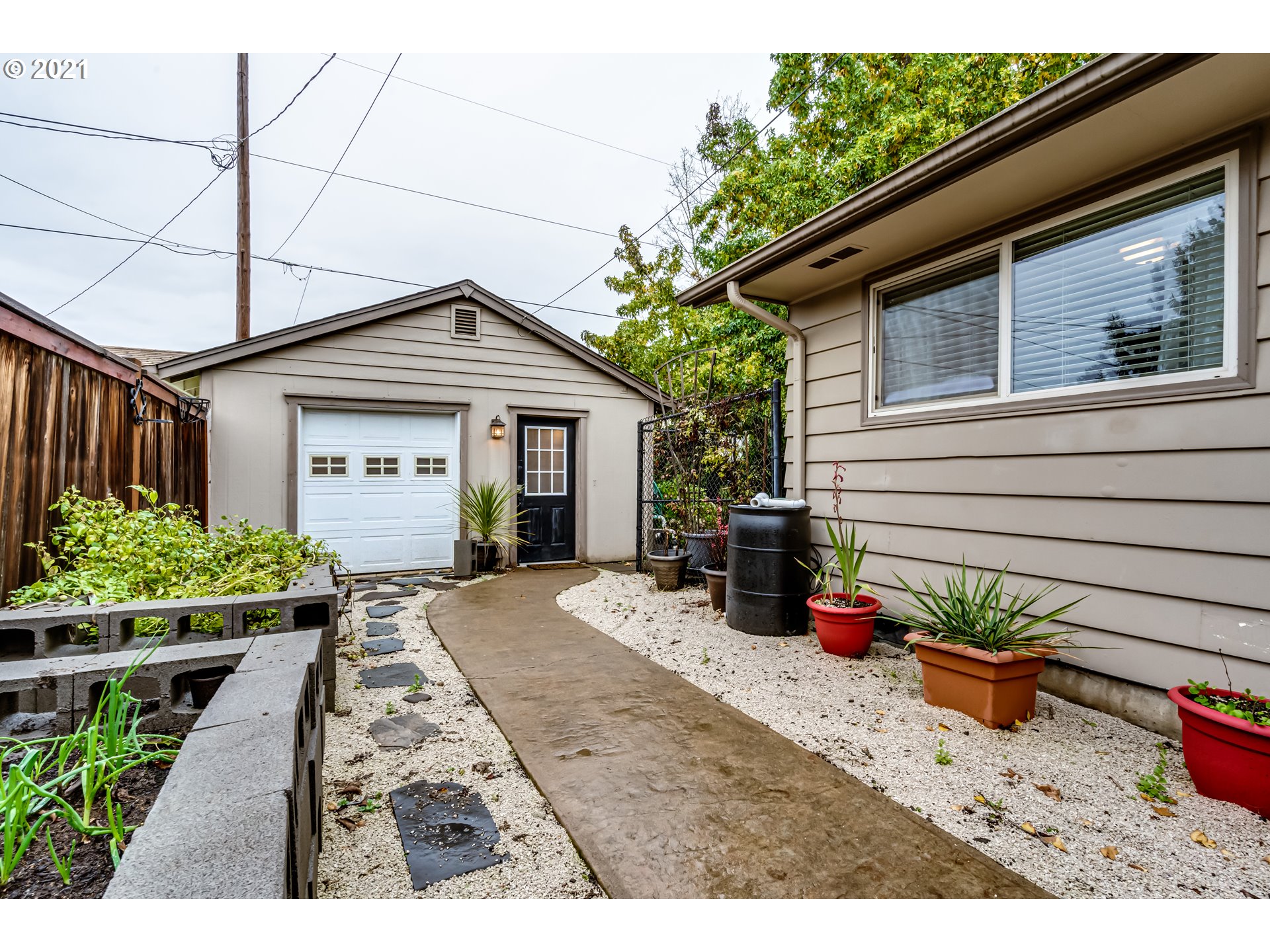 3324 Montebello Avenue Springfield, OR 97477 - Photo 26 of 32 a view of a house with sitting area and potted plants