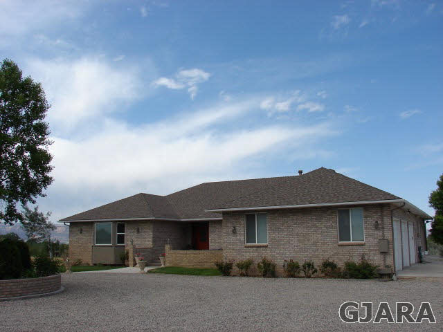 2524 I Road Grand Junction, CO 81505 - Photo 1 of 25 a front view of a house with garden