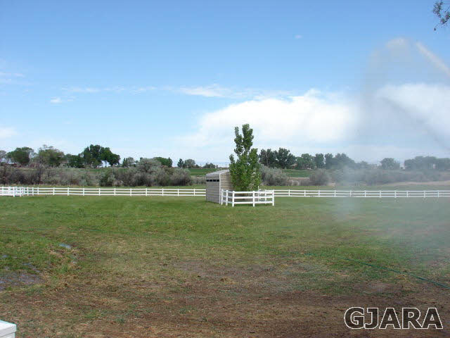 2524 I Road Grand Junction, CO 81505 - Photo 23 of 25 a view of a lake with houses in the back