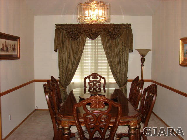 2524 I Road Grand Junction, CO 81505 - Photo 4 of 25 a view of a dining room with furniture and chandelier
