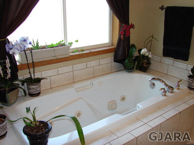 2524 I Road Grand Junction, CO 81505 - Photo 7 of 25 a bathroom with a bathtub and sink
