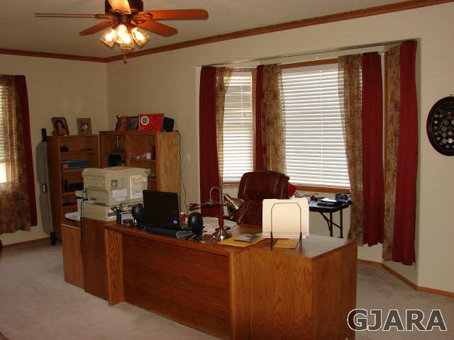 2524 I Road Grand Junction, CO 81505 - Photo 8 of 25 a room with furniture a chandelier and a window