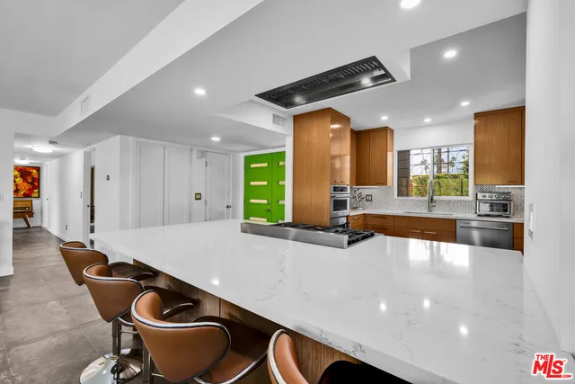 a kitchen with a stove and cabinets