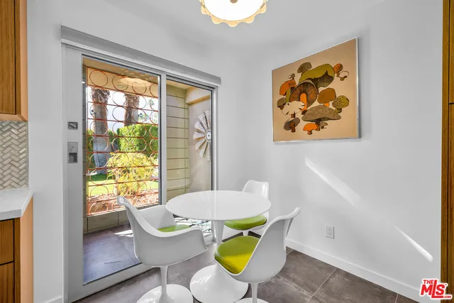 a bedroom with furniture and window