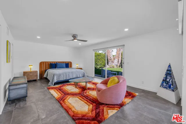 a bed room with a bed and a window