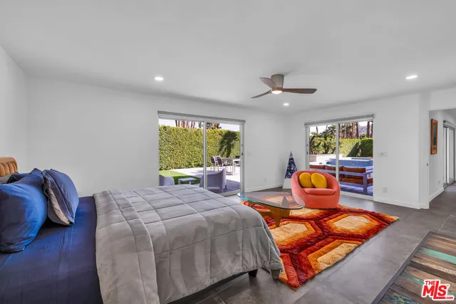 a bedroom with bed and window