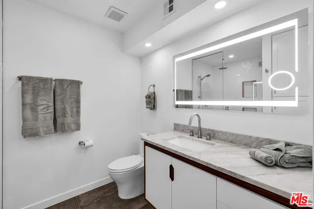a front view of a house with a yard table and chairs