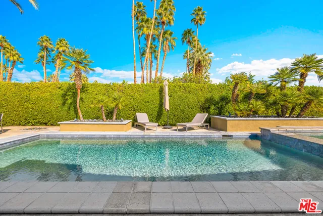 a view of a house with pool patio outdoor seating