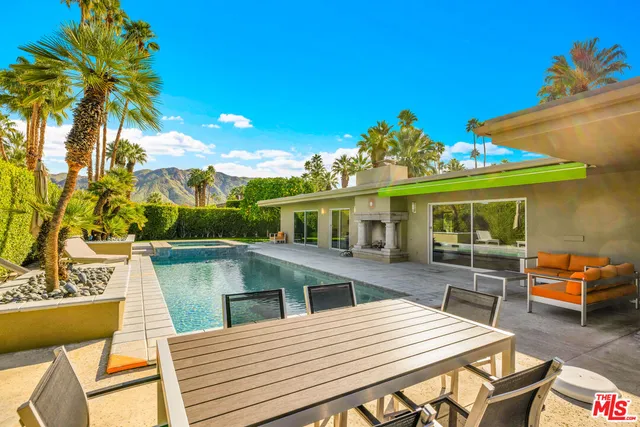 a view of an chairs and table in the patio