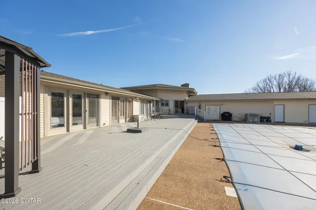 a front view of a house with swimming pool