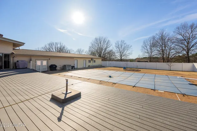 a living room with furniture a chandelier and a fireplace