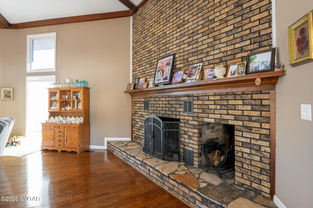 a kitchen with a sink cabinets and wooden floor