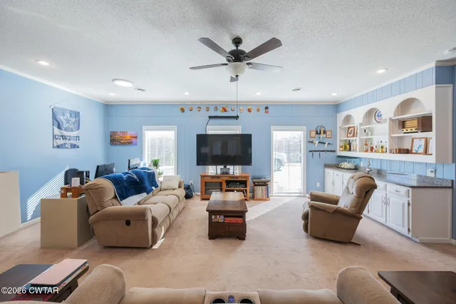 a bedroom with bed and window