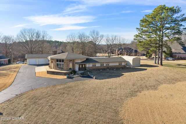 a view of a town with swimming pool and sitting area