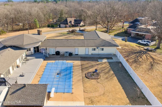a view of a swimming pool with lounge chair