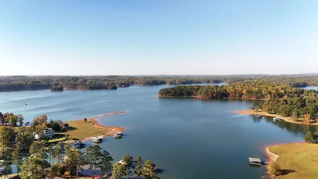 an aerial view of a house with a lake view