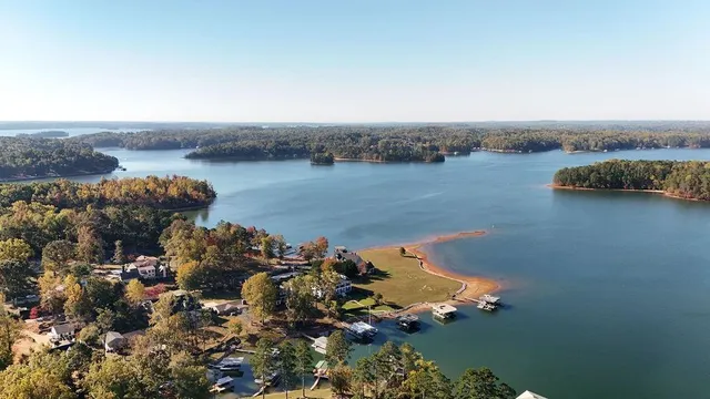 an aerial view of a house with a lake view