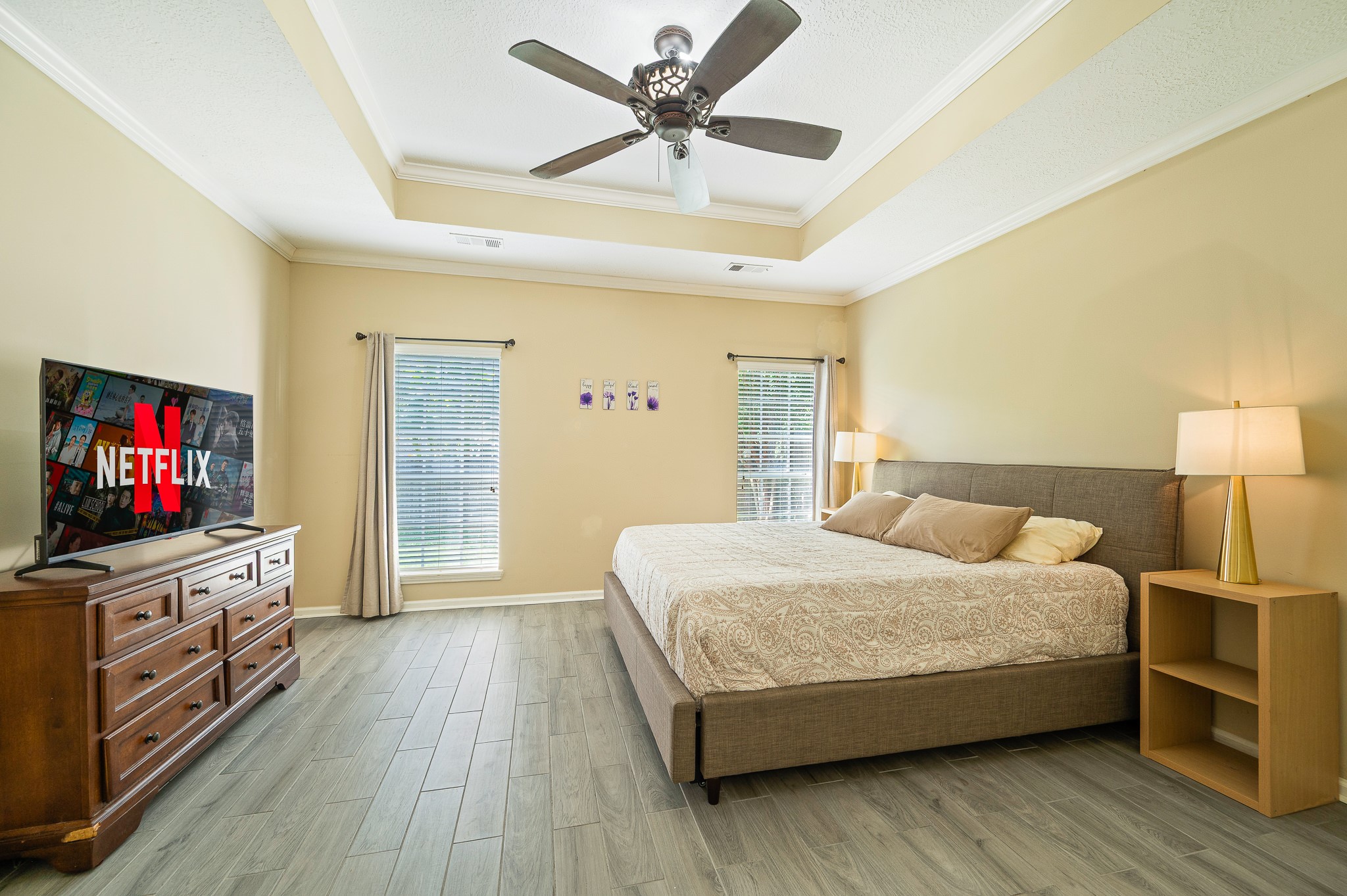 8111 Morningbrook Court Spring, TX 77379 - Photo 21 of 46 The expansive primary suite provides a peaceful retreat with abundant natural light, high ceilings, and plenty of space to relax and unwind.