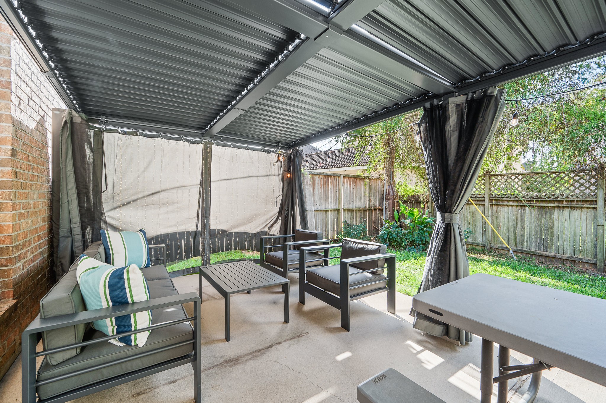 8111 Morningbrook Court Spring, TX 77379 - Photo 41 of 46 The louvered pergola creates a shaded outdoor retreat, ideal for enjoying morning coffee or unwinding in the evening.