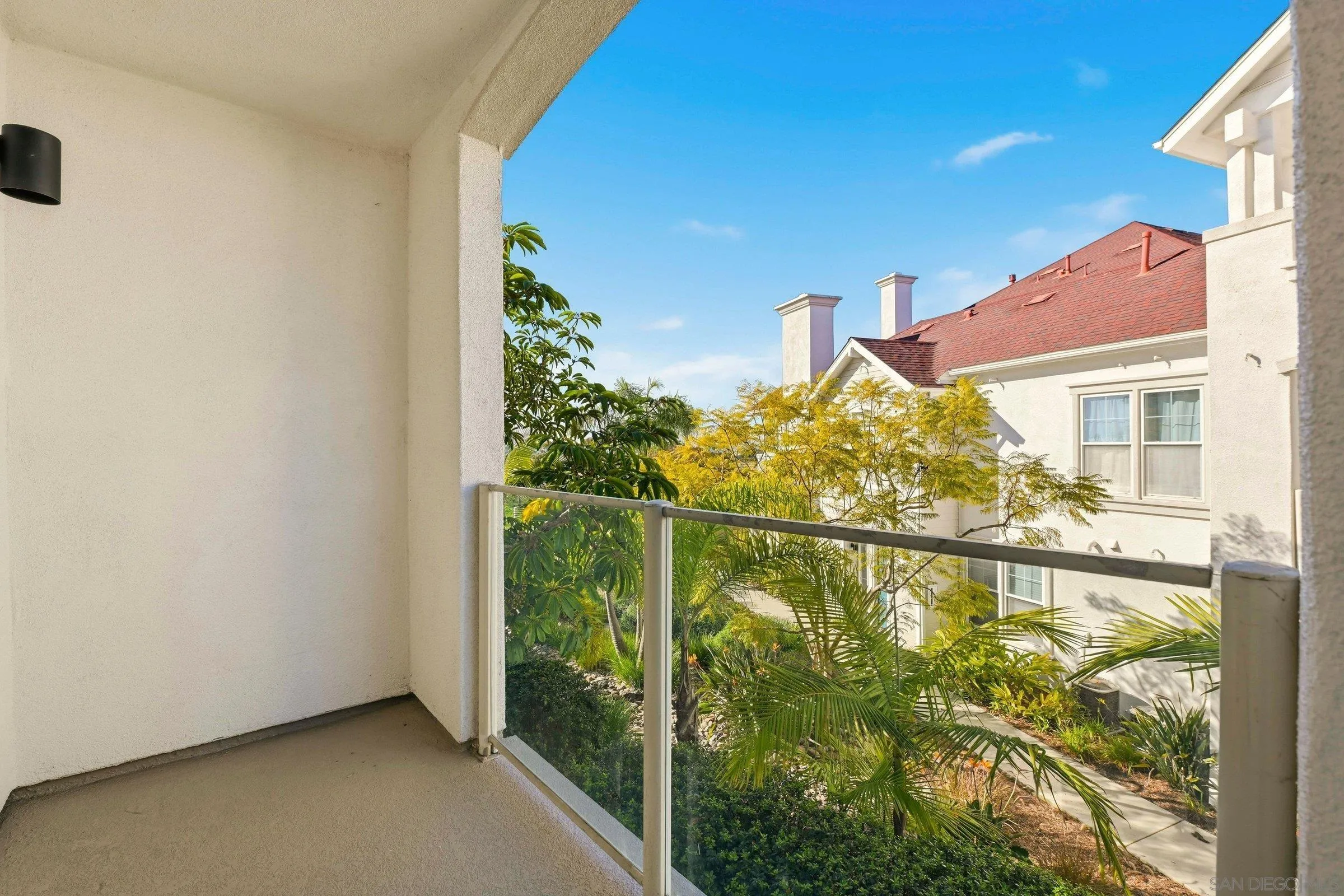 845 Harbor Cliff Way, Unit 305 Oceanside, CA 92054 - Photo 22 of 31 a view of a glass door with a yard