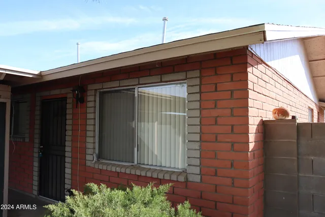 a front view of a house with a garage