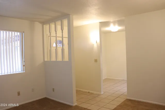 a view of empty room with windows