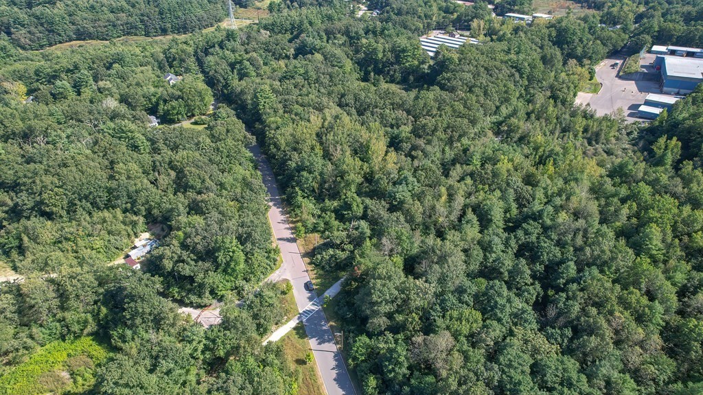 76 Brook Street Holliston, MA 01746 - Photo 18 of 31 an aerial view of residential house with outdoor space and trees all around