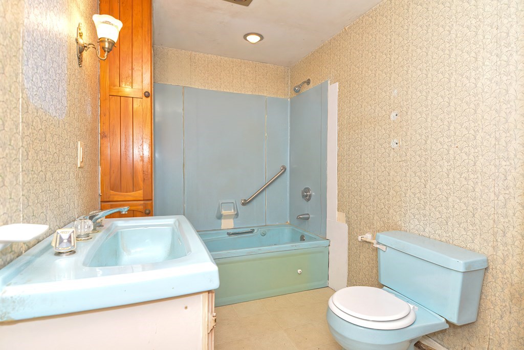 76 Brook Street Holliston, MA 01746 - Photo 25 of 31 a bathroom with a sink a toilet and tub