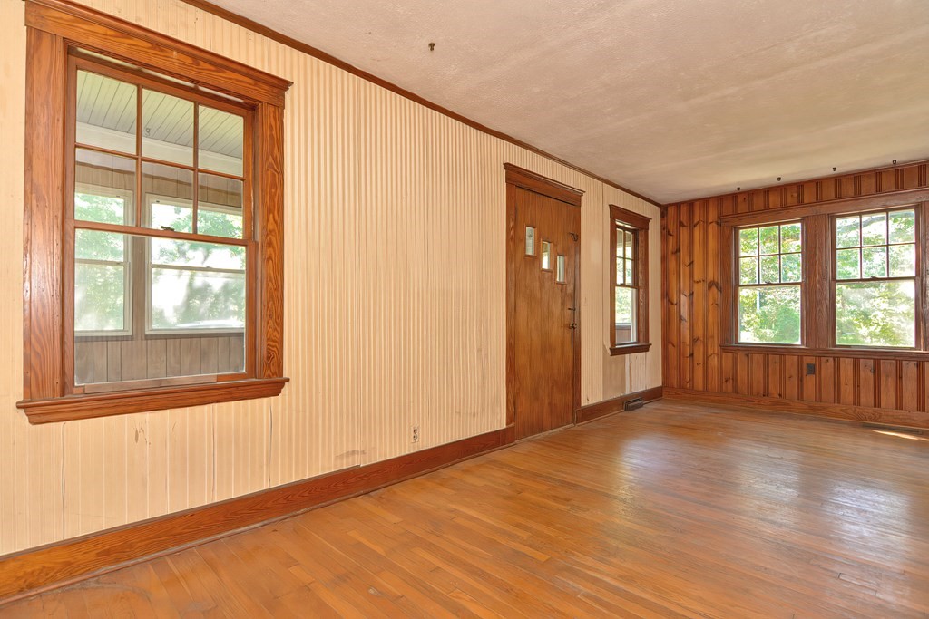 76 Brook Street Holliston, MA 01746 - Photo 26 of 31 an empty room with wooden floor and windows