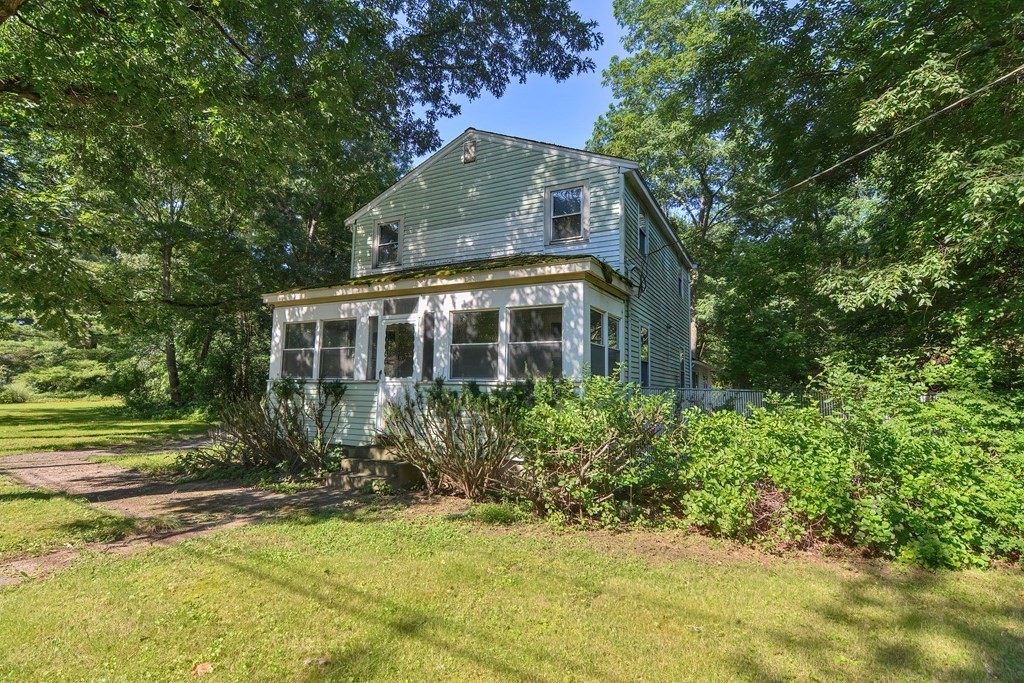 76 Brook Street Holliston, MA 01746 - Photo 3 of 31 a front view of house with yard