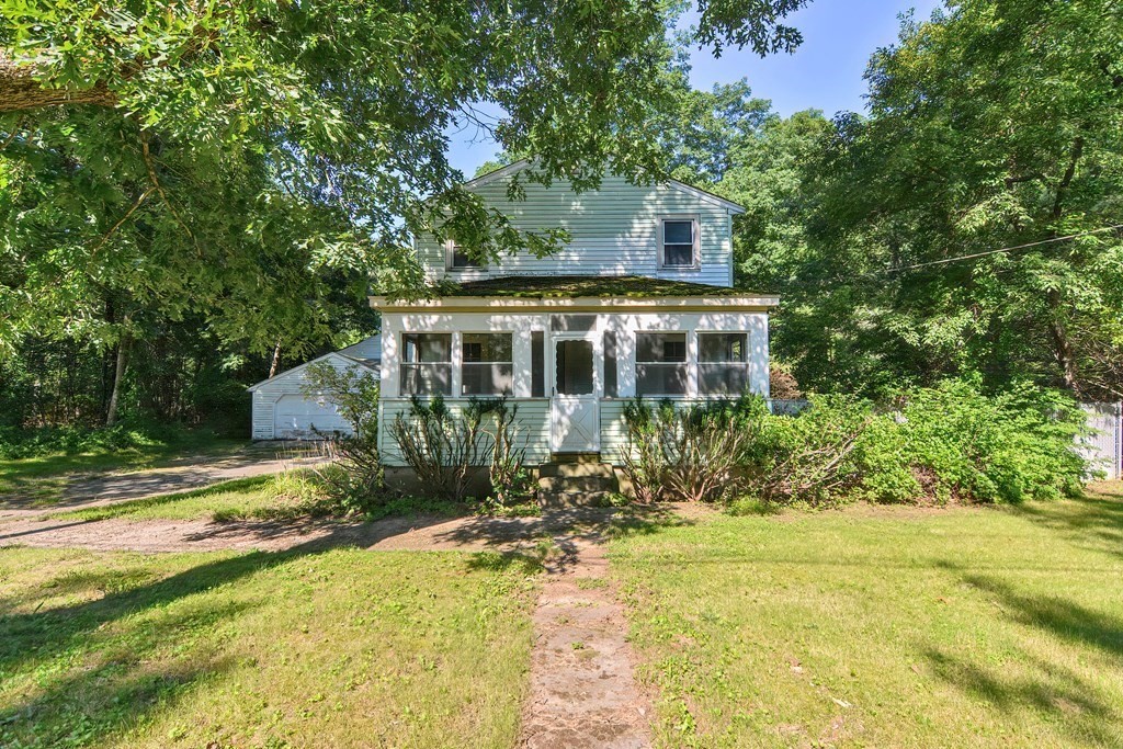 76 Brook Street Holliston, MA 01746 - Photo 4 of 31 a house view with a garden space