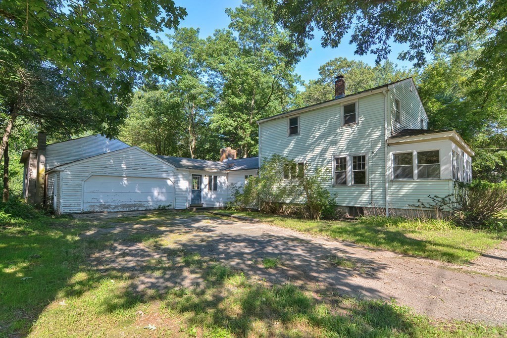 76 Brook Street Holliston, MA 01746 - Photo 5 of 31 a view of a house with a yard