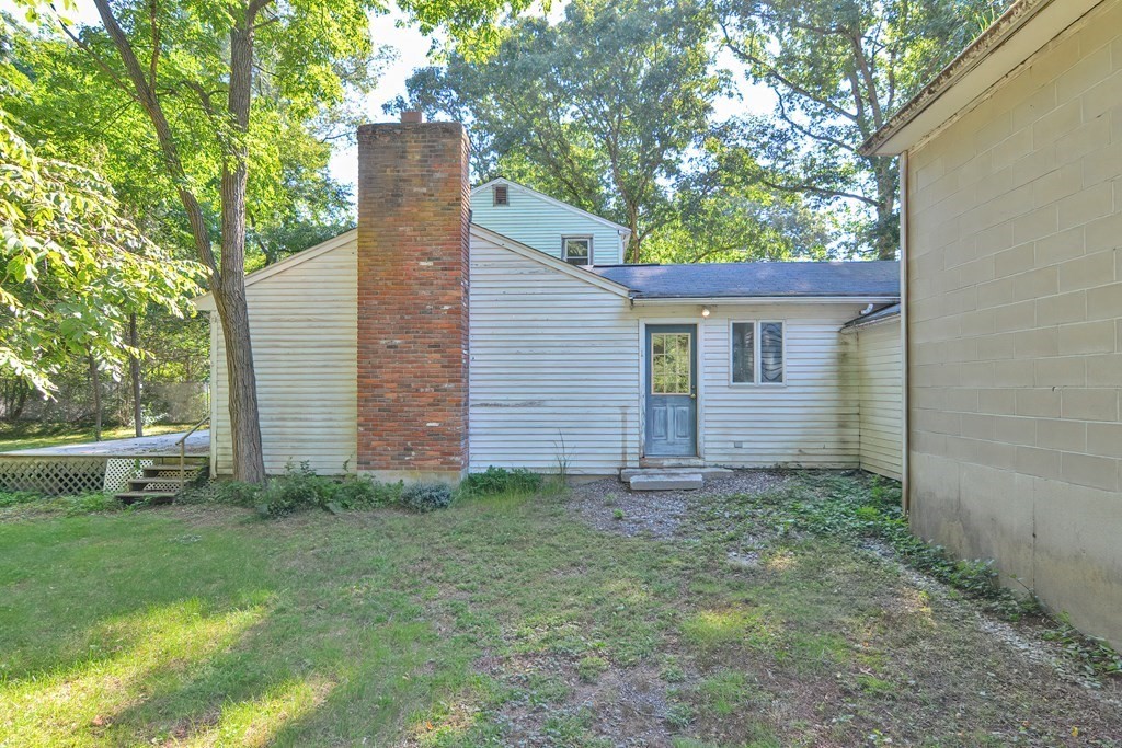 76 Brook Street Holliston, MA 01746 - Photo 6 of 31 a backyard of a house with lots of green space