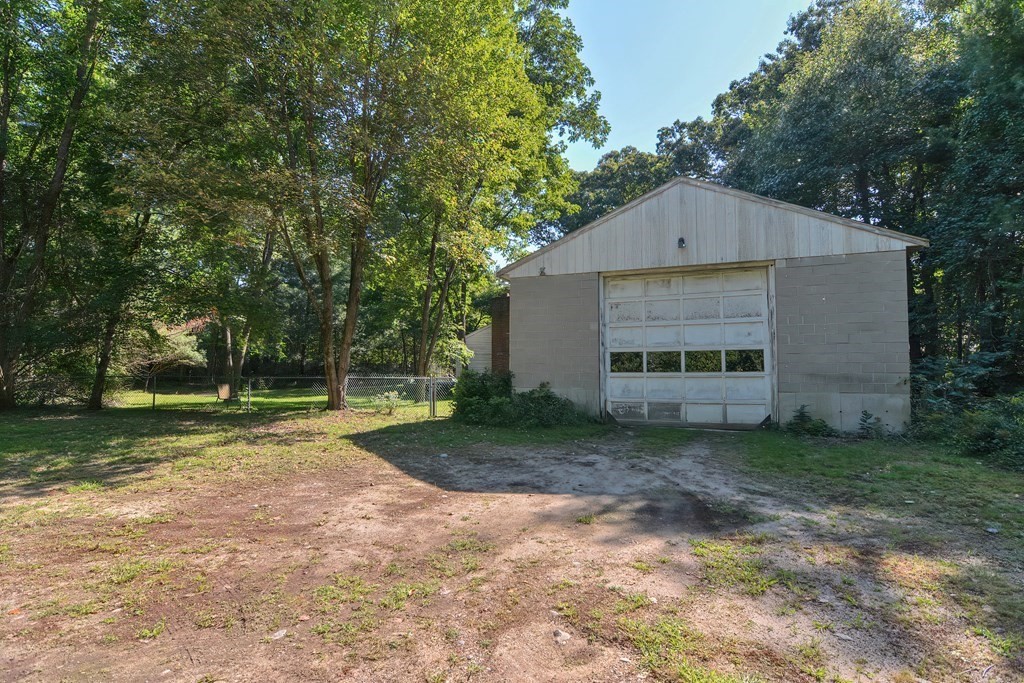 76 Brook Street Holliston, MA 01746 - Photo 9 of 31 a view of a house with backyard and garden