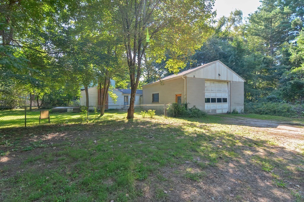 76 Brook Street Holliston, MA 01746 - Photo 10 of 31 a view of a house with a backyard