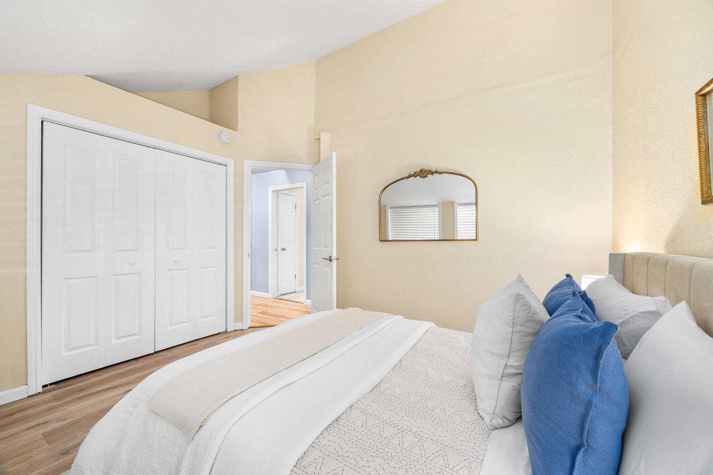 1644 Ocean Street Santa Cruz, CA 95060 - Photo 31 of 60 a bedroom with a bed and a mirror