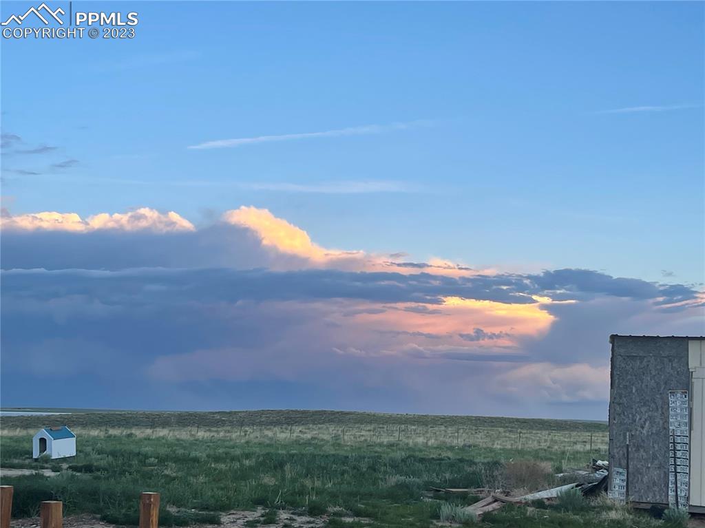 30595 Fred View Road Yoder, CO 80864 - Photo 13 of 21 a view of an ocean and a yard