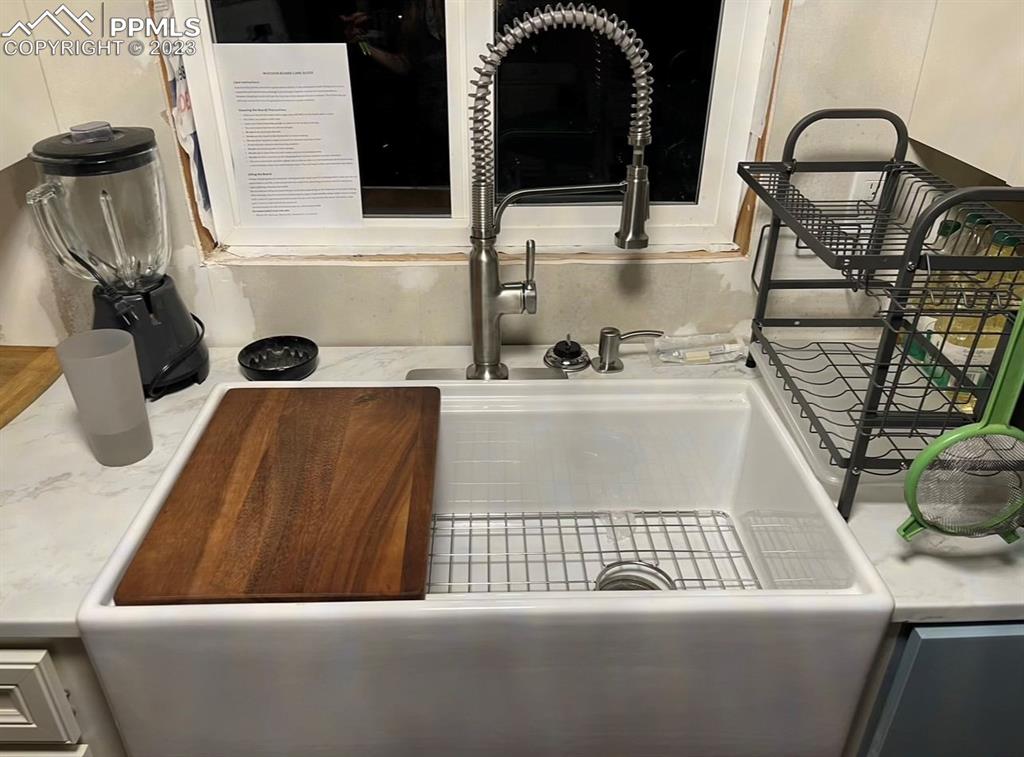 30595 Fred View Road Yoder, CO 80864 - Photo 5 of 21 a bathroom with a sink and a mirror