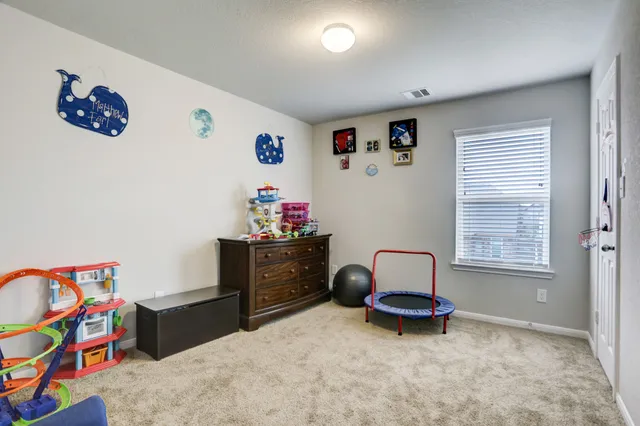 a room with toys and a window
