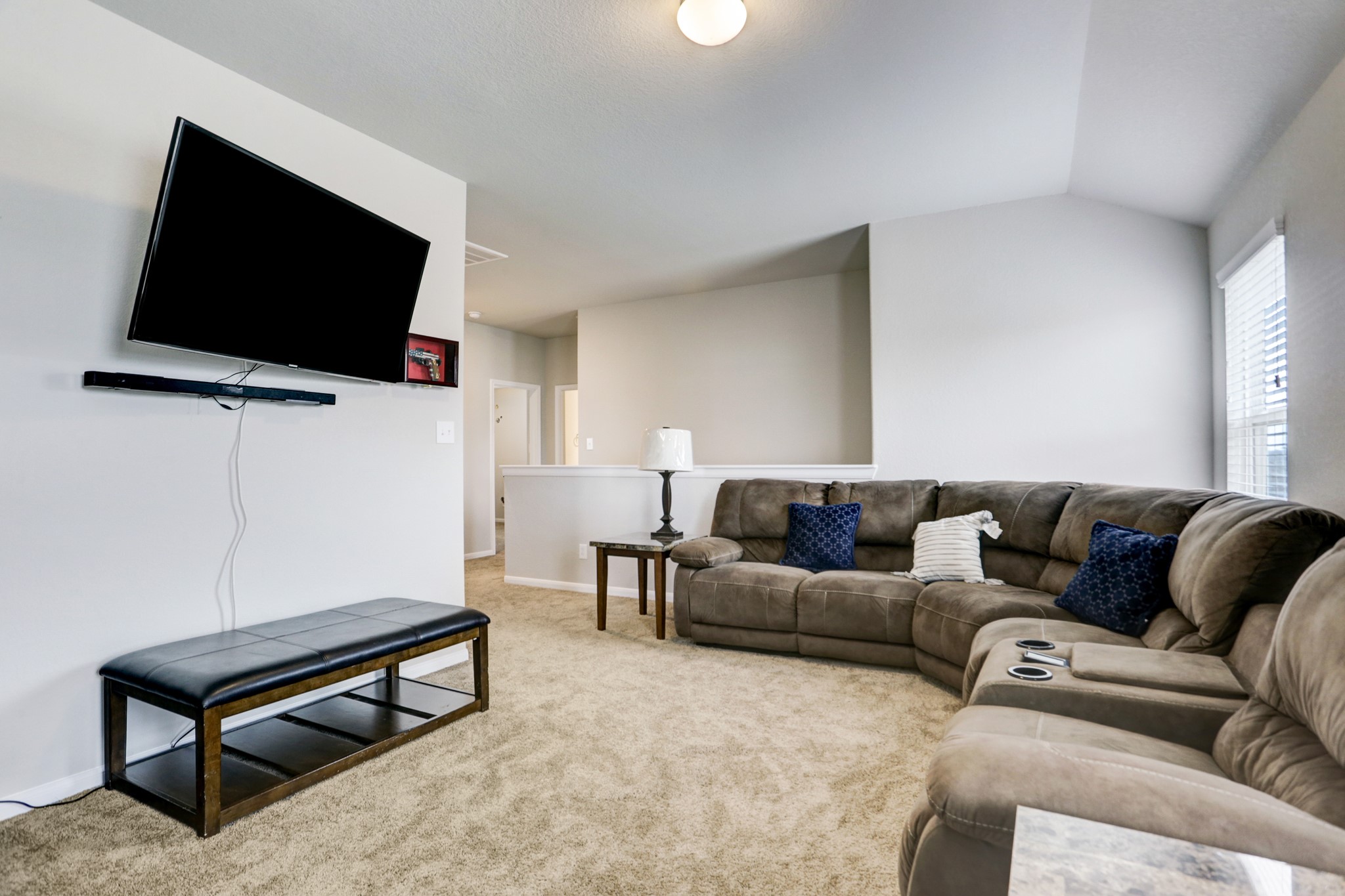 5414 Rustic Ruby Drive Fulshear, TX 77423 - Photo 12 of 18 a living room with furniture and a flat screen tv