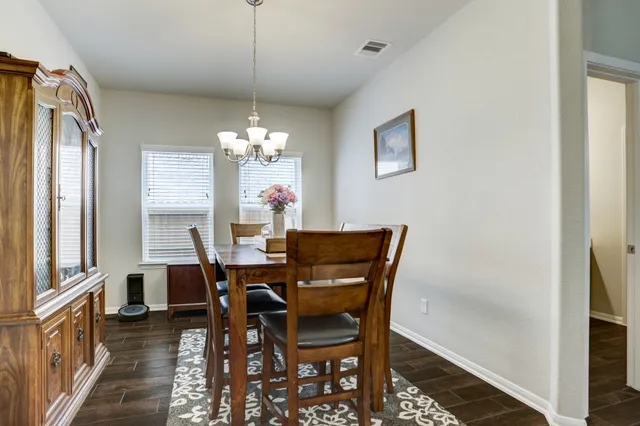a dining room with furniture and window