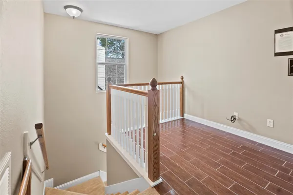 an aerial view of a house with a yard and lake view