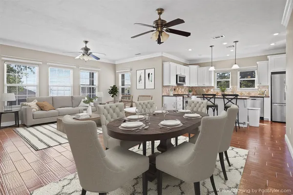 a kitchen with granite countertop a stove sink and microwave
