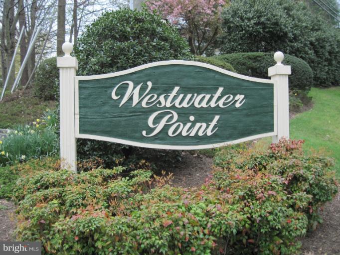 7439 Ridge Oak Court Springfield, VA 22153 - Photo 9 of 10 a sign broad in front of flowers